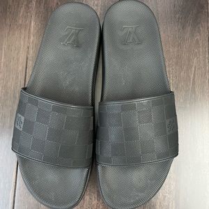 Louis Vuitton men’s black slides.